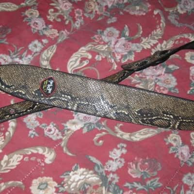 lite use RockYou (Rock You) PU Faux Leather Snakeskin Pattern Guitar Strap (front: brown, tan, black pattern) (back: black) reversible - main part of strap 2 & 3/4" wide, belt part 1 & 1/4" wide [polyurethane leather] Adjustable Length from 44" to 53" image 10