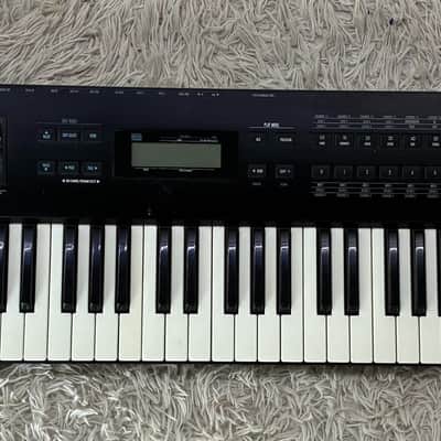 Alesis QS7.1 76-Key Synthesizer Keyboard w/ Folding X Stand – Very Good