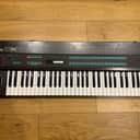 Yamaha DX7 MKI with Flight Case + Original Pedals + Cartridges
