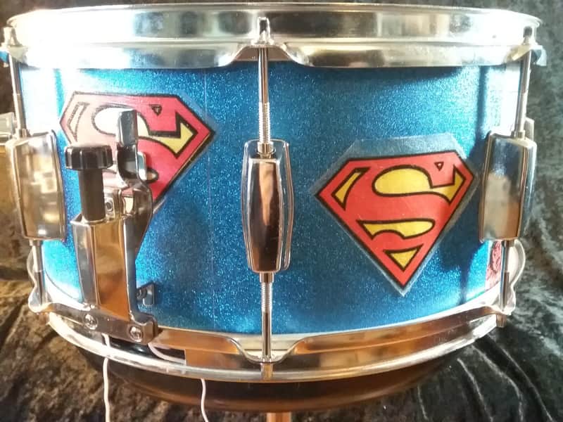 Pearl Export custom Assaulted Battery two color Superman themed graphics over a blue sparkle wrap. image 1