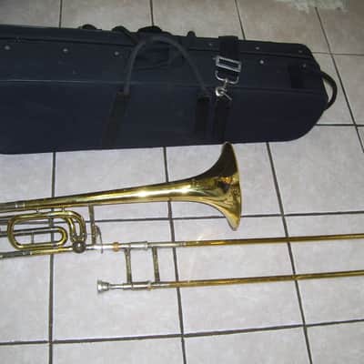 New Gold color trigger trombone,  With case and mouthpiece image 2