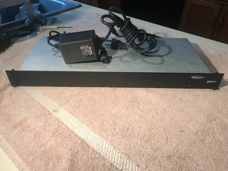 Biamp MSP11 Digital Signal Processor: leveling, compression, limiting, soft-gating, 1/3-octave + parametric EQ, and high-pass/low-pass filters. Includes power supply, input output connectors & rack mount bolts and washers image 1