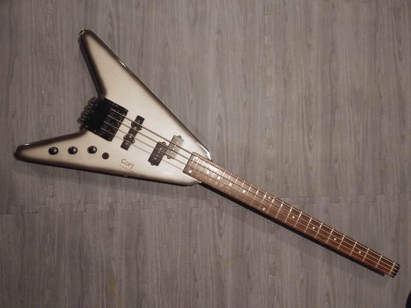 Cort Space Arrow Bass 1980's Headless Flying V Silverburst image 1