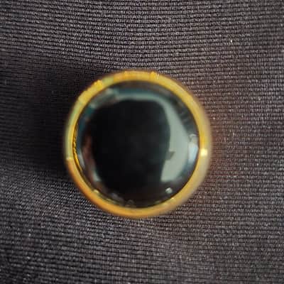 Gold and black tone knob with screw image 2
