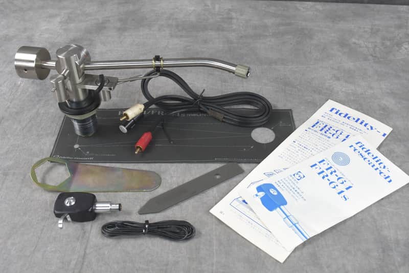 Silver and black adjustable microphone stand with attached cable and accessories.