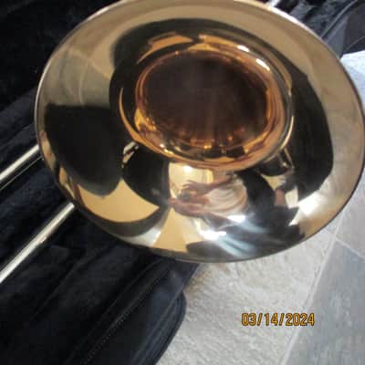 New Gold color trigger trombone. With case and mouthpiece. image 6