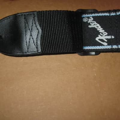 new with tags genuine Fender 2" Monogrammed Guitar Strap Black, Light Gray, and Light Blue - Fender part number: 099-0681-502, Fully adjustable length (39"-72") Woven Fender logo and guitar headstock design, polyester backing, black leather ends image 13