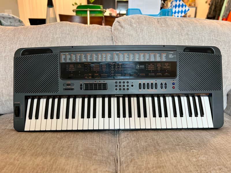 Casio CTK-1000 with adapter image 1