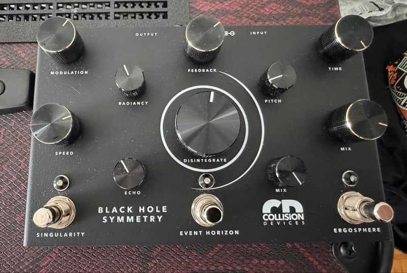 Collision Devices Black Hole Symmetry