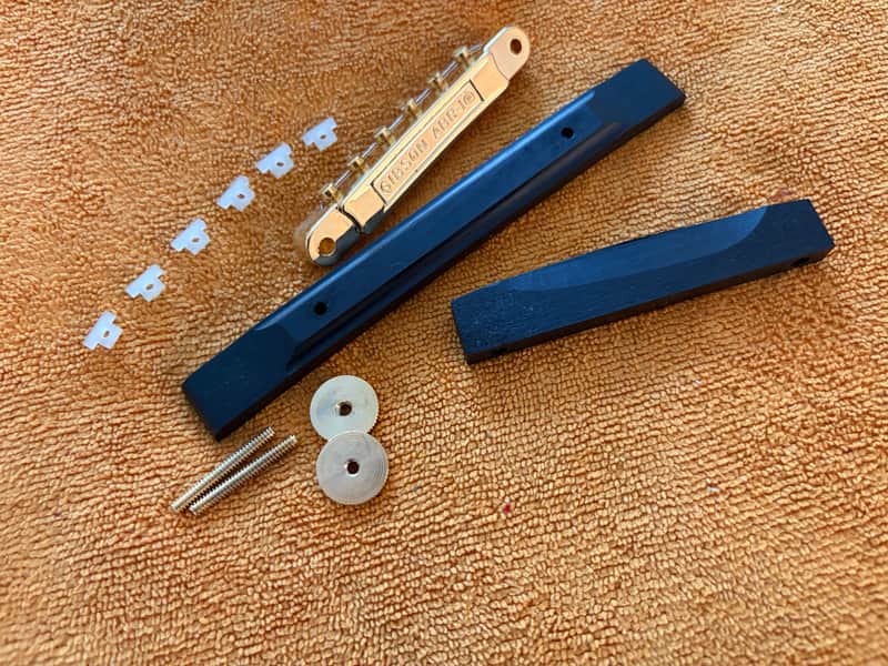 NOS-70’s Gibson Ebony Archtop/Carved Top Bridge Base & Saddle Assembly Polished Grade #1 Ebony w/ Gold Hardware and 2025  ABR-1 Wired 24K Gold Plated bridge - COMBO image 1