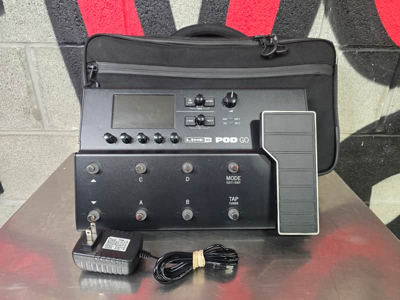 Black Line 6 POD GO multi-effects unit with digital display and various knobs.