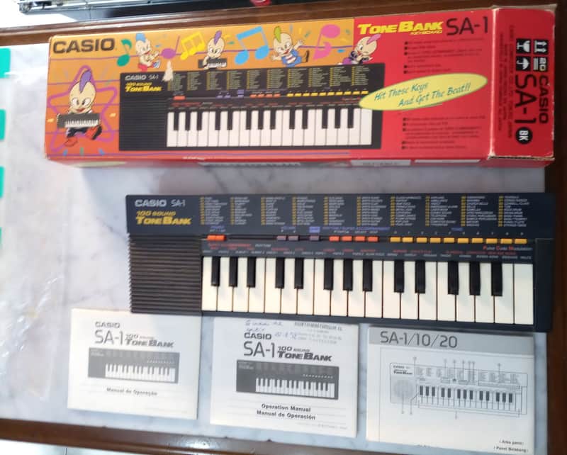 Casio SA-1 3 BOOK MANUAL 6 PATTERN PULSE CODE MODULATION PCM 100 TONE BANK 1989 - mini keyboard with complex LO-FI wavetable sounds PC Kid Techo Punk pop Japan Anime Manga Black BOXED RARE image 1