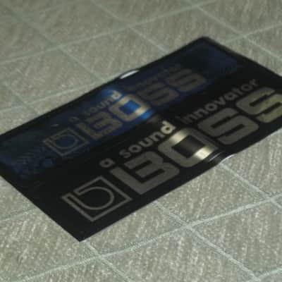 never used genuine BOSS sticker sheet (1 sheet has 2 stickers) 1) BOSS a sound innovator - colors Silver, Blue, Black Silver & 2) BOSS a sound innovator - colors Silver & Black (specifically from 1988), was orig paired w/ a DC3 Japan (pedal NOT included) image 2