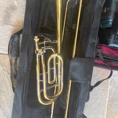 Immagine Gold color trigger trombone, With case and mouthpiece. Large bore - 8
