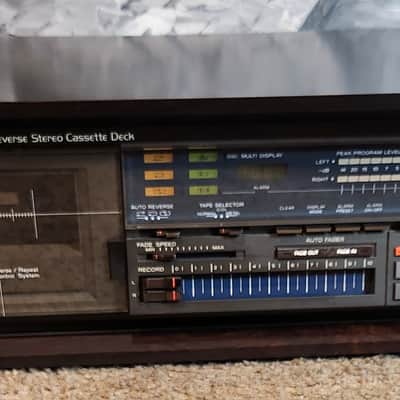 TEAC TEAC V-909RX is a vintage 3-motor auto-reverse stereo cassette 80s - Dark wood image 3