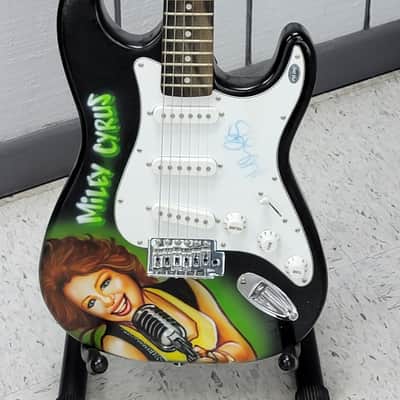 "Miley Cyrus" Autographed Guitar with "COA" image 2