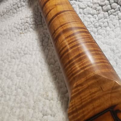 Immagine # HGS-R7-Unbelievable,5A,Nitro,Roasted flame maple neck with Killer flame maple head stock and NO fret tangs. Made for a Strat body. You never felt frets like this.! - 1