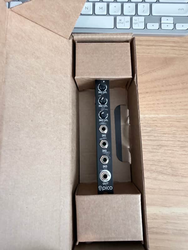 Black electronic pedal with multiple input/output jacks and knobs.