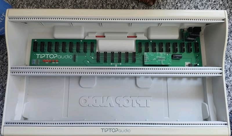 Black electronic audio equipment in its original packaging.