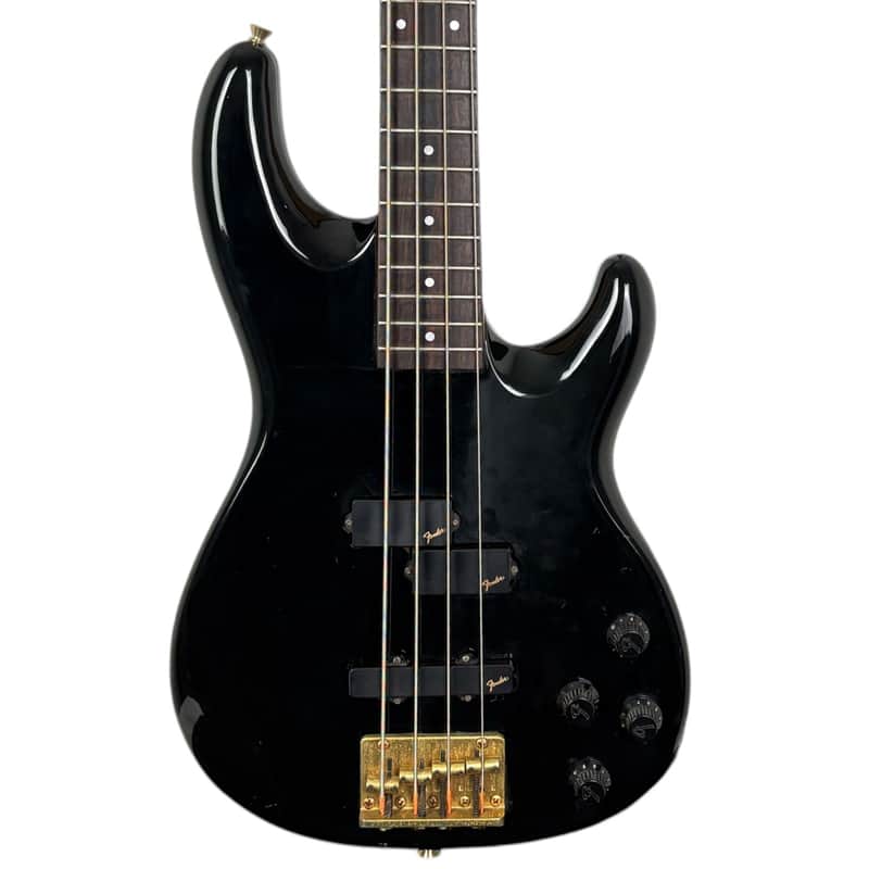 Black and white electric bass guitar with tortoiseshell pickguard.