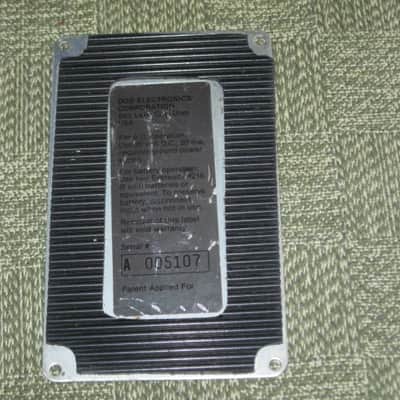 used vintage DOD Performer Series BOTTOM PLATE ( screw holes are on 4 corner areas) NO: pedal/other parts - early 1980s - Metal Plate has Silver & Gray Finish / Stiff Black Rubber Padding (padding has ridges) has Label, underside sanded & repainted gray image 1