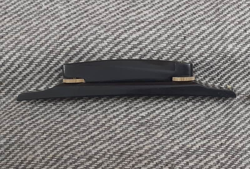 Plain Archtop Guitar Bridge -1 pc in Ebonywood with Golden wheels image 1