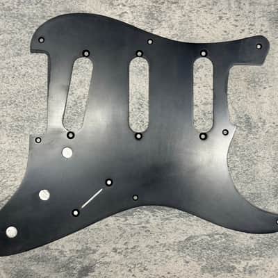 Real Life Relics Aged Black 57 Stratocaster® Pickguard 8 Hole 1 Ply .060.   (PGAV10)