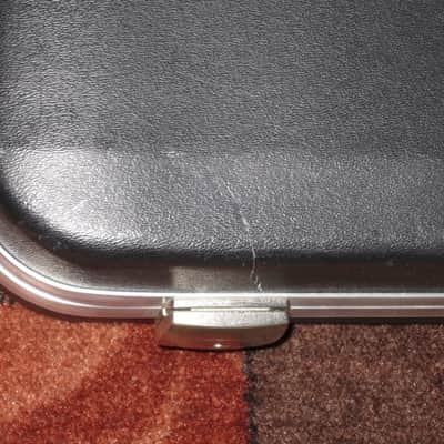 used Rickenbacker Hardshell Case for Model 620 electric guitar (NO guitar) from 1995, 2 Ball feet broke off (2 holes in plastic), Exterior plastic has some cracks,  EXT: Black Hard Plastic / Chrome HW / Handle: Black Molded Hard Plastic / INT: Blue Plush image 25