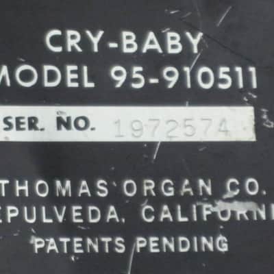 used vintage 1970s (Ser # 1972574) Thomas Organ Cry-Baby Wah, model 95-910511, has orig TDK 5103, + battery (pot is NOT scratchy, works fine) battery clip was repaired, original foam padding for battery compartment area replaced, + extra rubber feet image 2