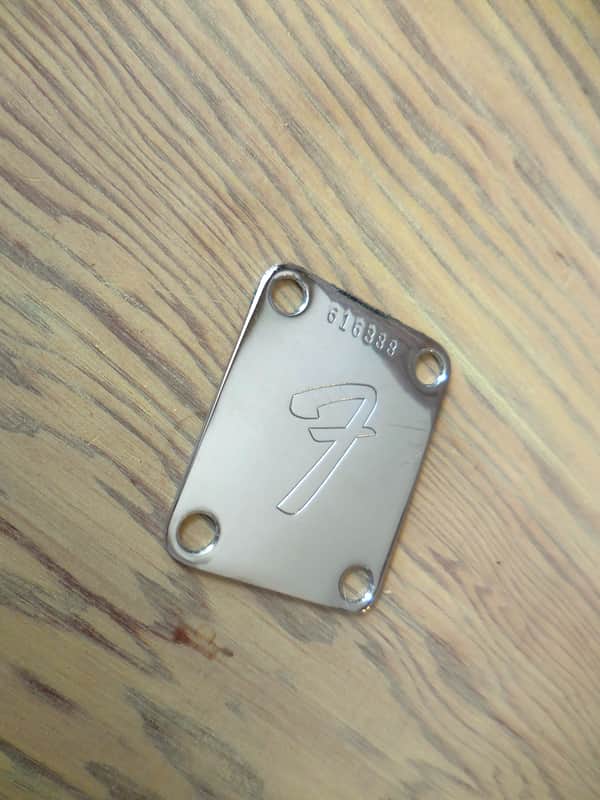 Fender Neck Plate 70's Serial Number with Original bolts. image 1