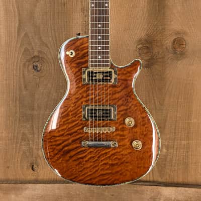 Jay Turser Les Paul Style Cutlass F Electric Guitar – Quilted Amber Burst – Used