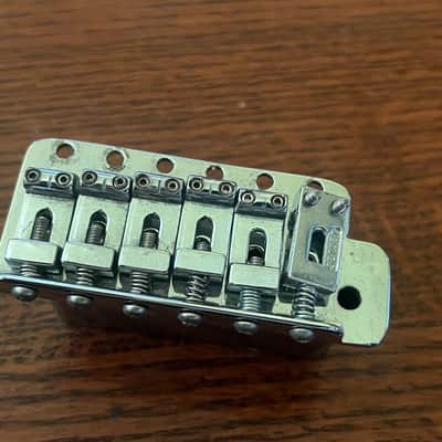 1970s Fender Stratocaster guitar tremolo bridge stamped saddles image 1
