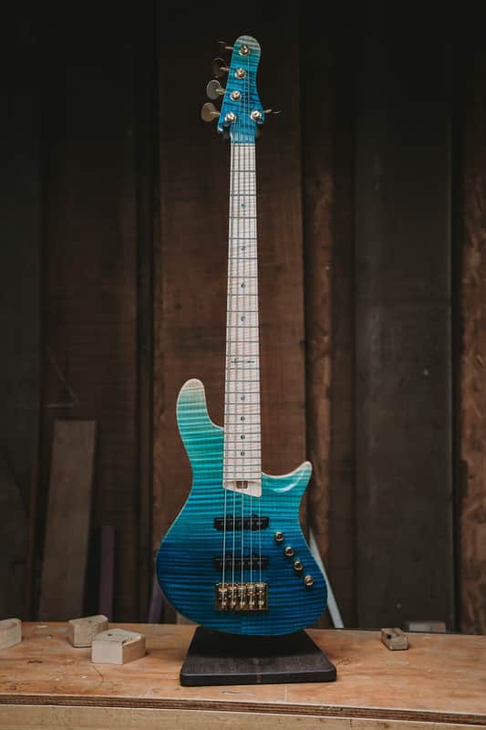 Warrior Isla J Ocean Blue Fade Flame 5 string NEW