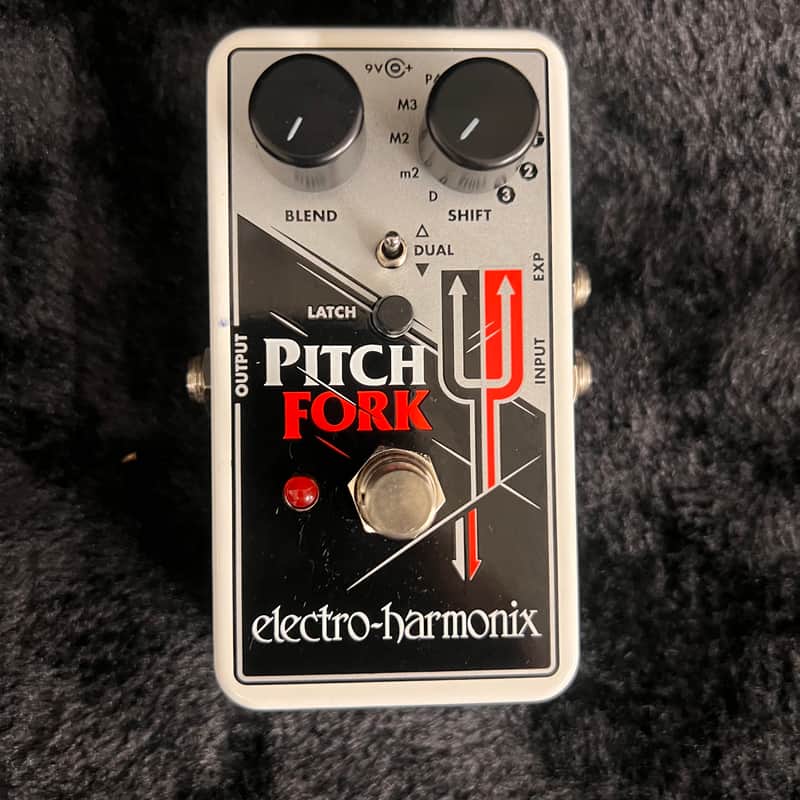 White and black electro-harmonix Pitch Fork effects pedal with knobs and switch.