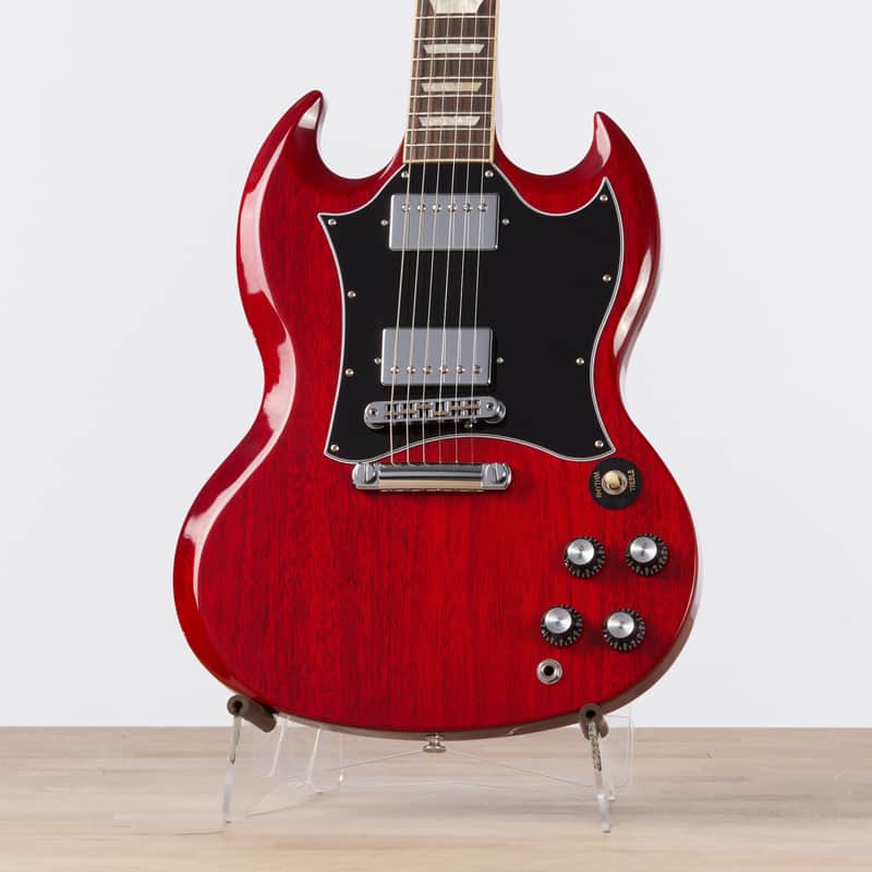 Red and black electric guitar, solid body, visible hardware, clean condition.
