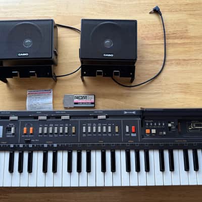 Casio MT-800 Casiotone 49-Key Synthesizer With Speakers, Transformer & Casio ROM-Packs