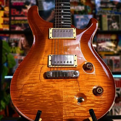 with a Flame Maple top, Mahogany neck with a Wide-Fat profile, East Indian Rosewood fretboard with moon inlays, Straight stoptail bridge, McCarty treble and bass pickups, finished in McCarty Sunburst, with nickel hardware. image 4