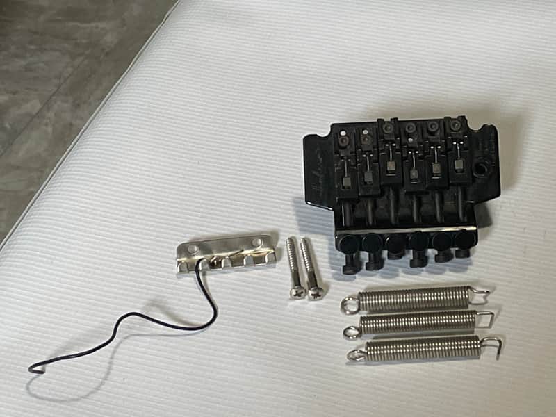 1990's Jackson King V & Dinky Guitars JT-580 Takeuchi Black Licensed Floyd Rose Tremolo Guitar Bridge image 1