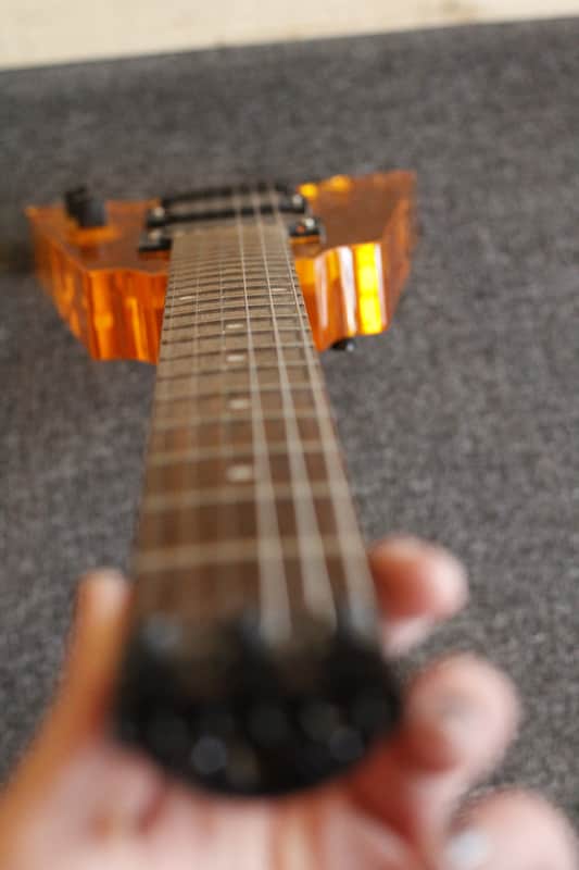 Headless 6 string guitar, Orange Lucite, Overlord of Music, | Reverb