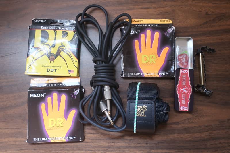Quick I Have A Heavy Metal Gig Next Week 1 Guitar Strap 1 15 Foot Cable 2 Packs Neon DR Strings 9 Light Gauge With 1 Drop DR Tuning Pack 5 Heavy Hard Pick Set & Capo Neon luminescent (glow-in-the-dark) image 1