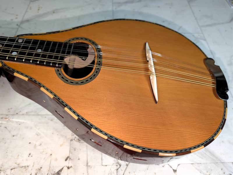 Taisamlu A-Shape Mandolin with strap and soft case.  Fresh set up.  New strings.  Nut and bridge saddle are bone.  Plays nicely.  Sounds great.  Its loud! image 1
