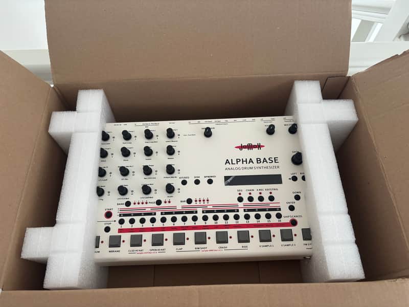 Yamaha Alpha Base analog drum synthesizer with white panel and black controls.