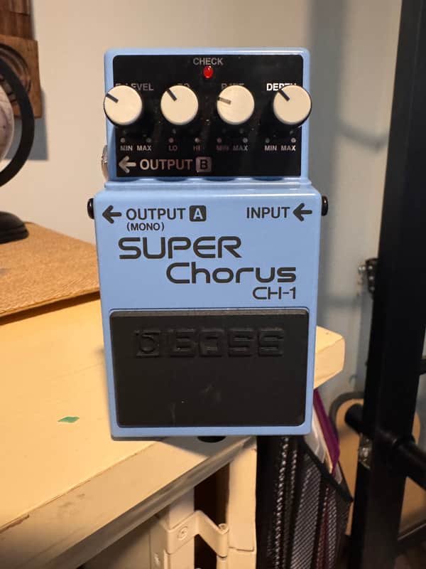 Blue Boss Super Chorus effects pedal with knobs and jacks.