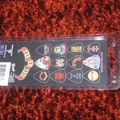 new in package (old stock) A+ Perri's Leather Ltd. / Perri's 12 Pack Of Guns N Roses Guitar Picks - Med Gauge - Celluloid Plastic, 351 shape - but slightly curved (LP12-GNR1) LP12GNR1 image 16