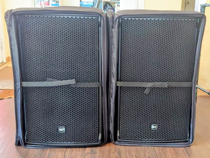 Two RCF NX 45-A 15" Active Speakers with covers image 1