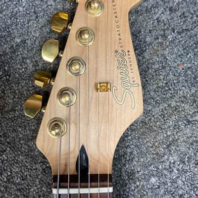 Squier Pro Tone Stratocaster with Rosewood Fretboard in Crimson Red Transparent 1997 image 8