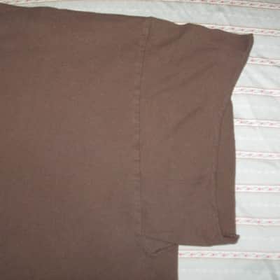 pre-owned genuine Fender Lightning Bolt Logo Short Sleeve, Cotton T-Shirt, XL, Brown (sleeves cut shorter) PN: 9101008621, from 2010, GRAPHIC: Red, Creme, Dark Brown, Fender, Ligntning Bolt, Circles, musical symbols, Electric Instrument Company Since 1946 image 11