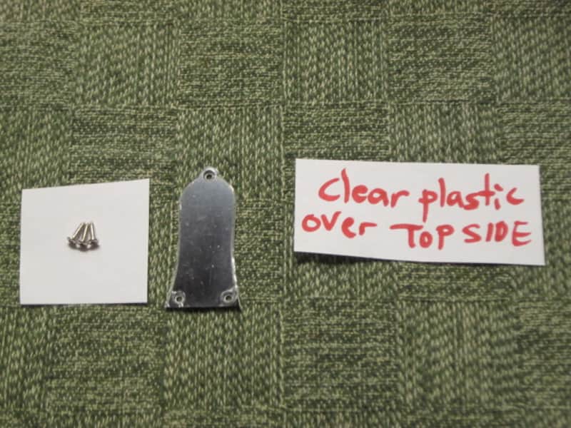 open package (near A+) unknown brand Epiphone 3 Hole Truss Rod Cover, blank (NO info), 2 ply (black front side / white bevelled edge, & white back side), bell shape + silver screws (TOP SIDE of cover has clear plastic over it), from 2020s image 1