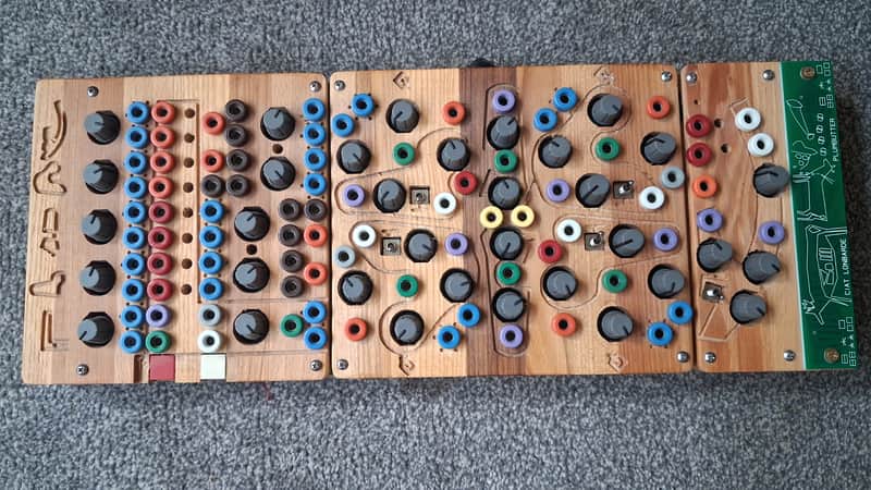 Three wooden display boards with colorful, mounted collectible buttons.