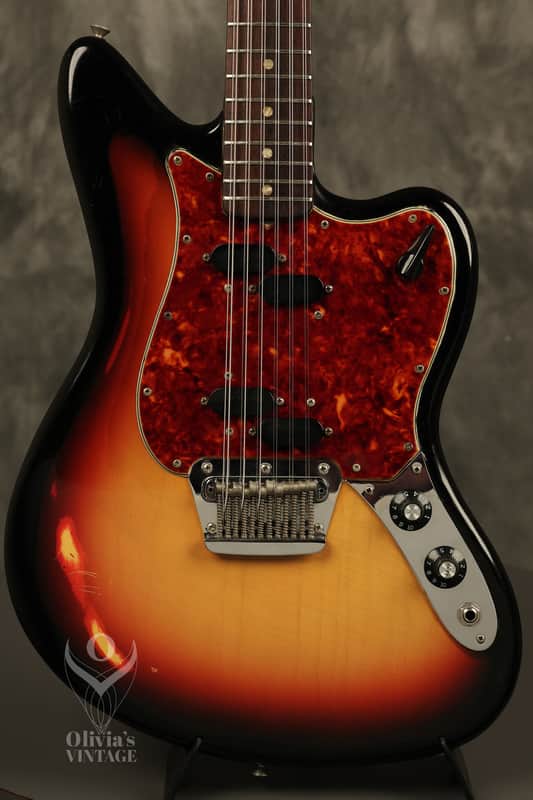 Yellow and red electric guitar with black body, visible tuning pegs.